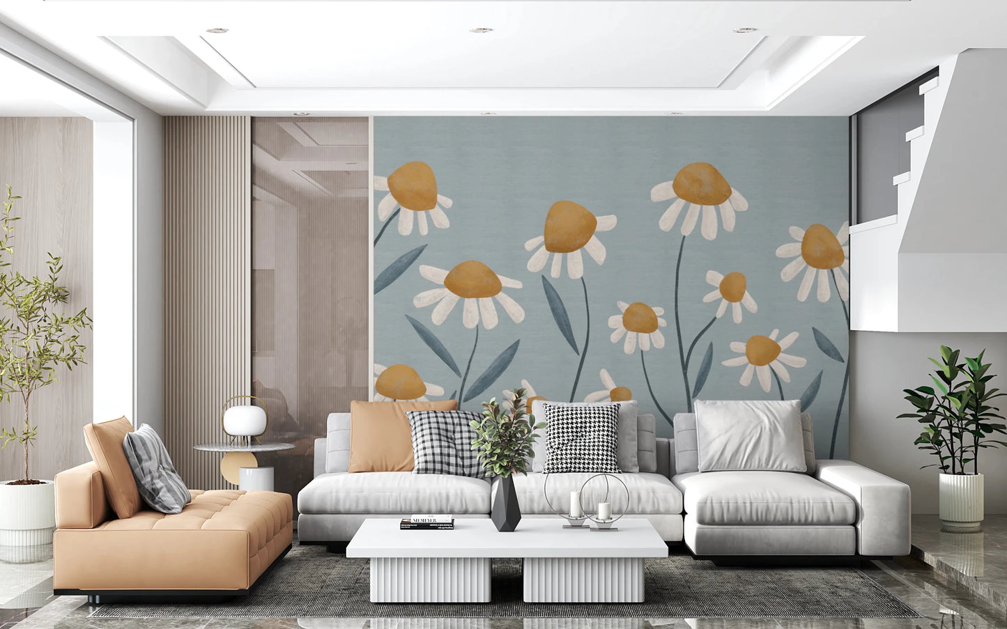 Sunny Daisy Field wallpaper mural of mustard daisies on blue behind a grey sectional and tan chaise in a living room