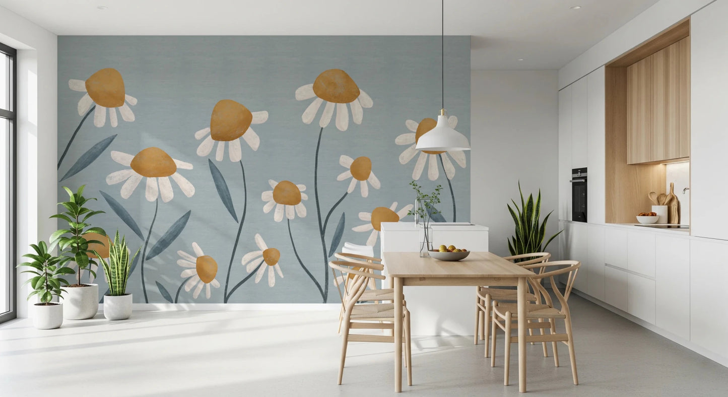 Sunny Daisy Field wallpaper mural with white daisies on dusty blue behind a wood table and wishbone chairs in a white kitchen