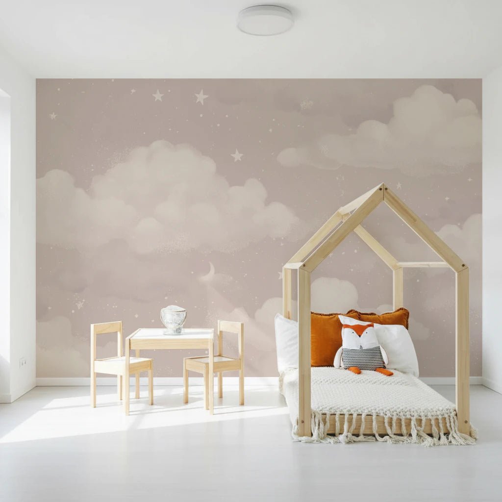 Sweet Dreams Blush wallpaper mural of pink clouds and stars in a kids room with a wooden house-frame bed and fox plush