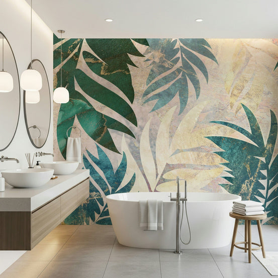 Tropical Luxe wallpaper mural of teal and gold palm leaves behind a freestanding tub and double vanity in a bathroom