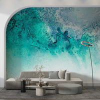 An artistic fluid pattern mural on minimalist wallpaper.