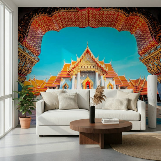 Temple of Dawn wallpaper mural framing an ornate Thai marble temple behind a white sofa in a bright living room