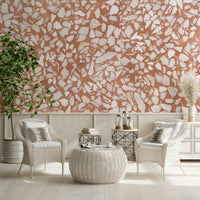 Sienna terra-cotta natural wallpaper. Lively stone fragment mosaic.