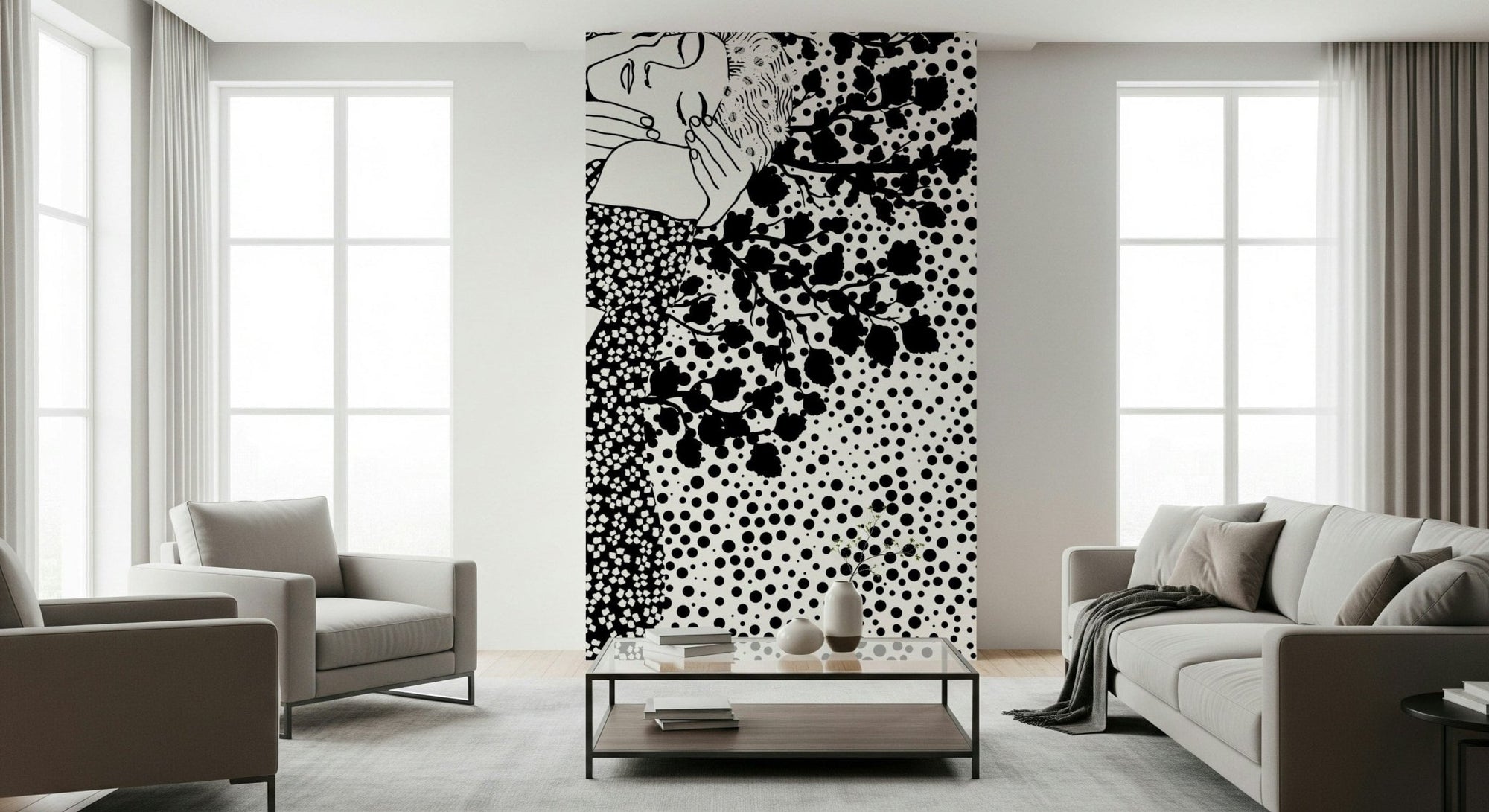 The Kiss II wallpaper mural in black and white of an embracing couple behind a grey sofa and armchairs
