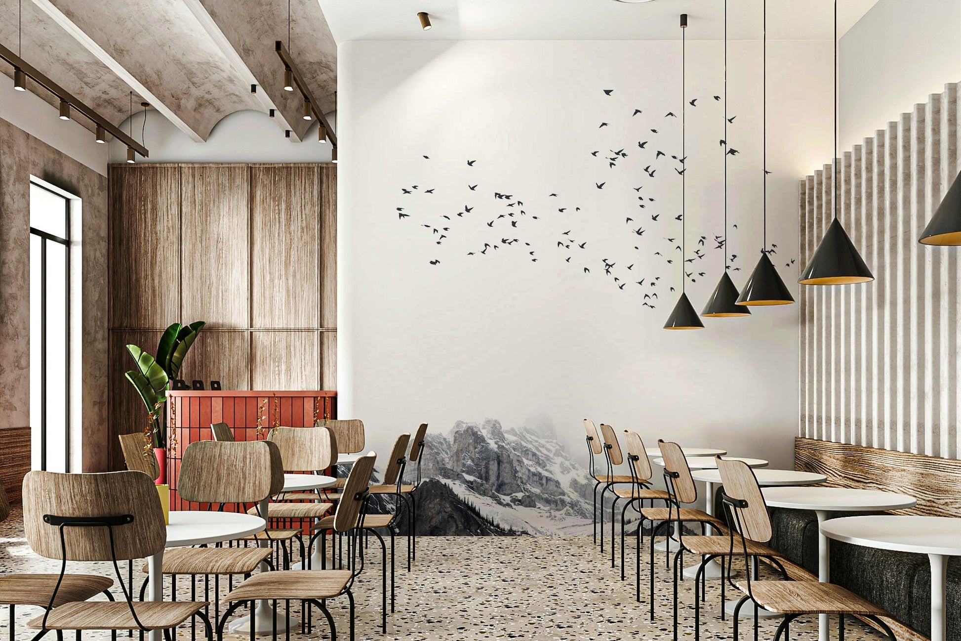 The scene might include snow-capped peaks, rugged cliffs, or forested slopes.
