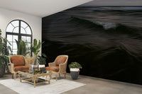 A living room with the ocean wave wall mural.

