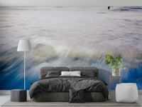 A peaceful open ocean mural on decorative wallpaper.

