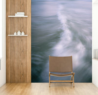 The wallpaper is used to create a feature wall in a dining room.

