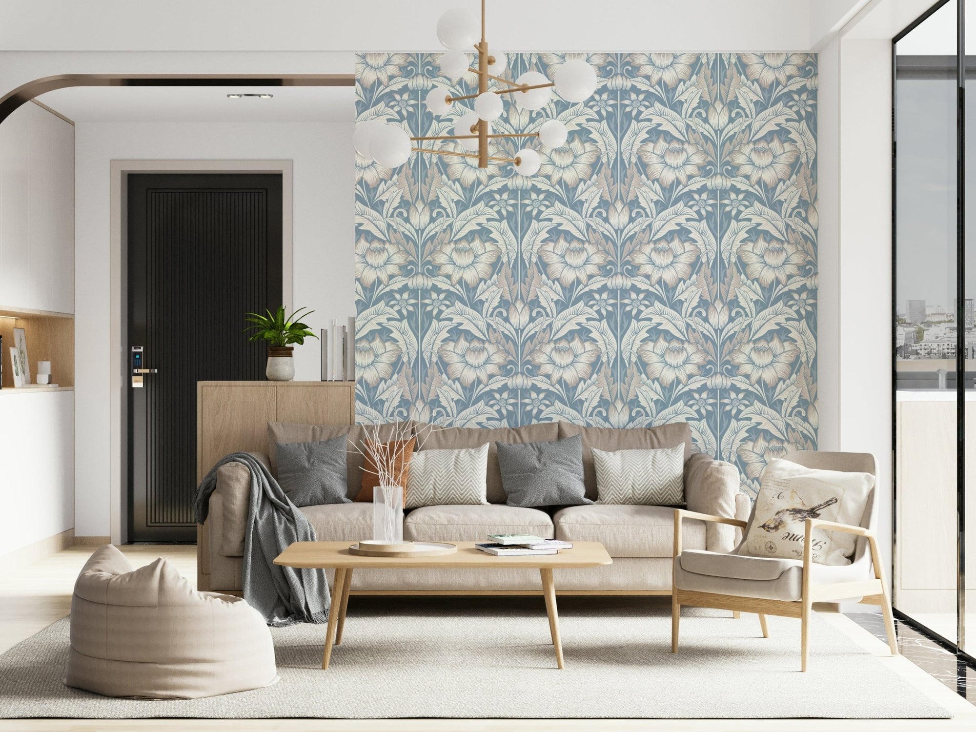 Timeless Garden Mist Blue wallpaper with blue and cream floral damask behind a beige sofa in a bright living room