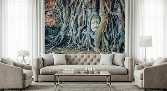 Timeless Harmony stone head nestled in grey banyan roots.
