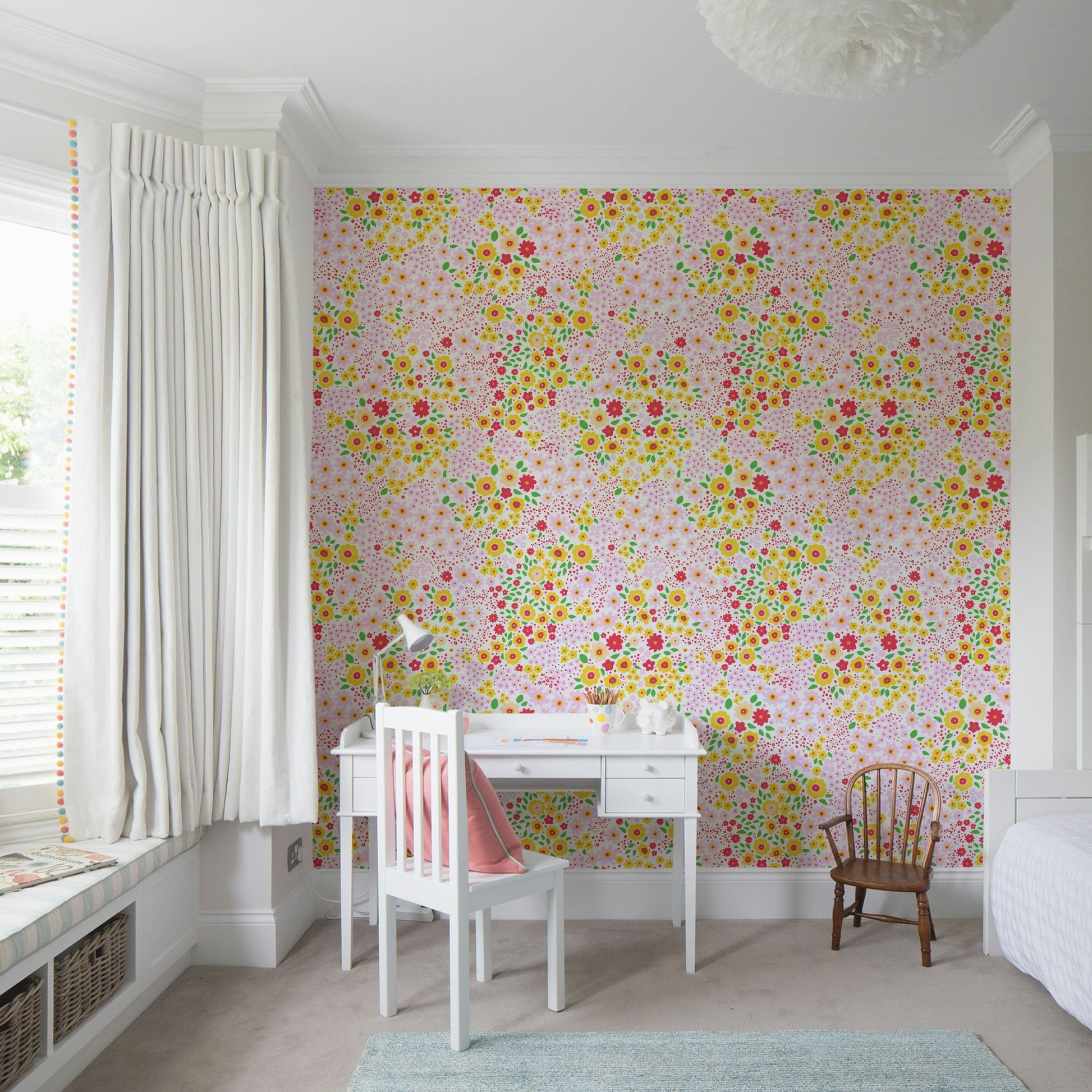 The flowers have bold, solid colors like yellow, pink, and green.
