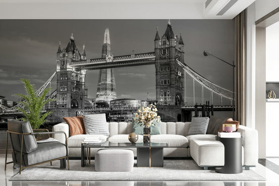 Tower Bridge and the Shard wallpaper mural over a cream sectional and black leather chair in a living room