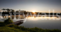 Tranquil Sunrise Reflection Over Serene Lake Wall Mural