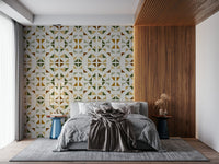 Modern foliage wallpaper with layered triangles in soft greens and neutral earthy tones.