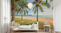 Palm-lined wall mural brightens airy bedroom view