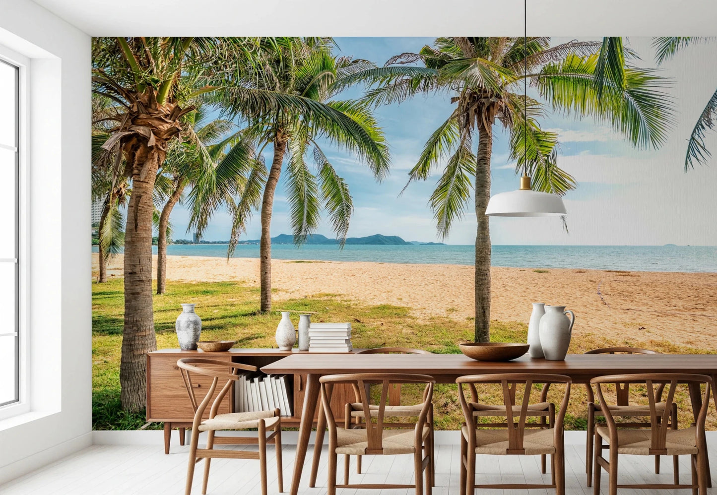 Sunset beach wall mural defines cafe seating area