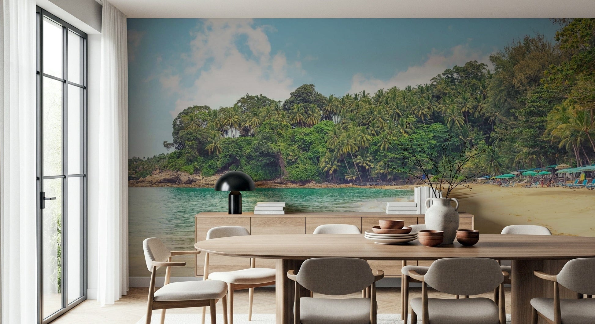 Tropical coastal wallpaper showing calm sea, forested shore, and open sky
