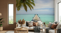 Tropical pier mural in guest room, calm coastal artwork, light wood pier and ocean backdrop
