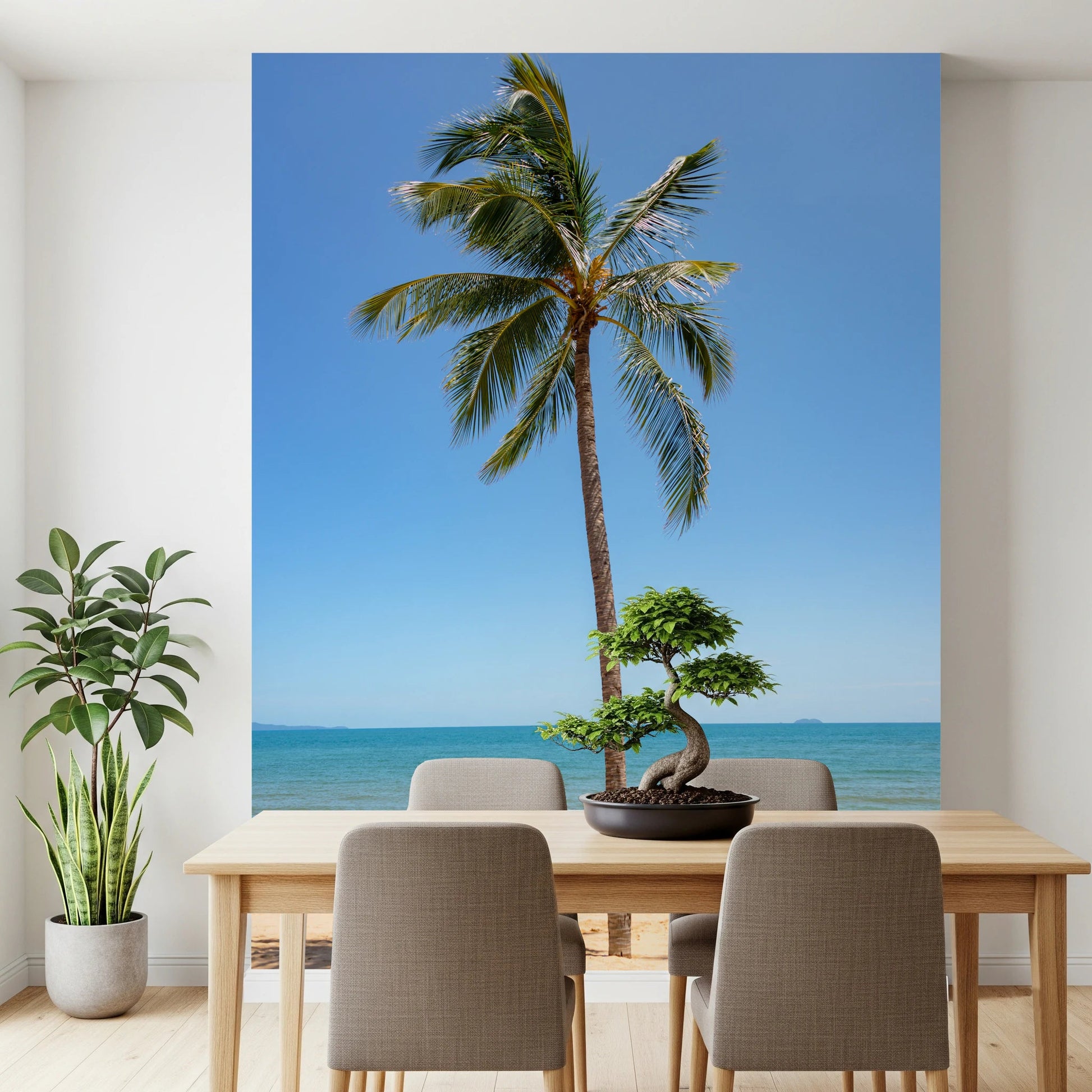 Tropical Retreat wallpaper mural of a beach palm tree behind a light wood dining table and beige chairs