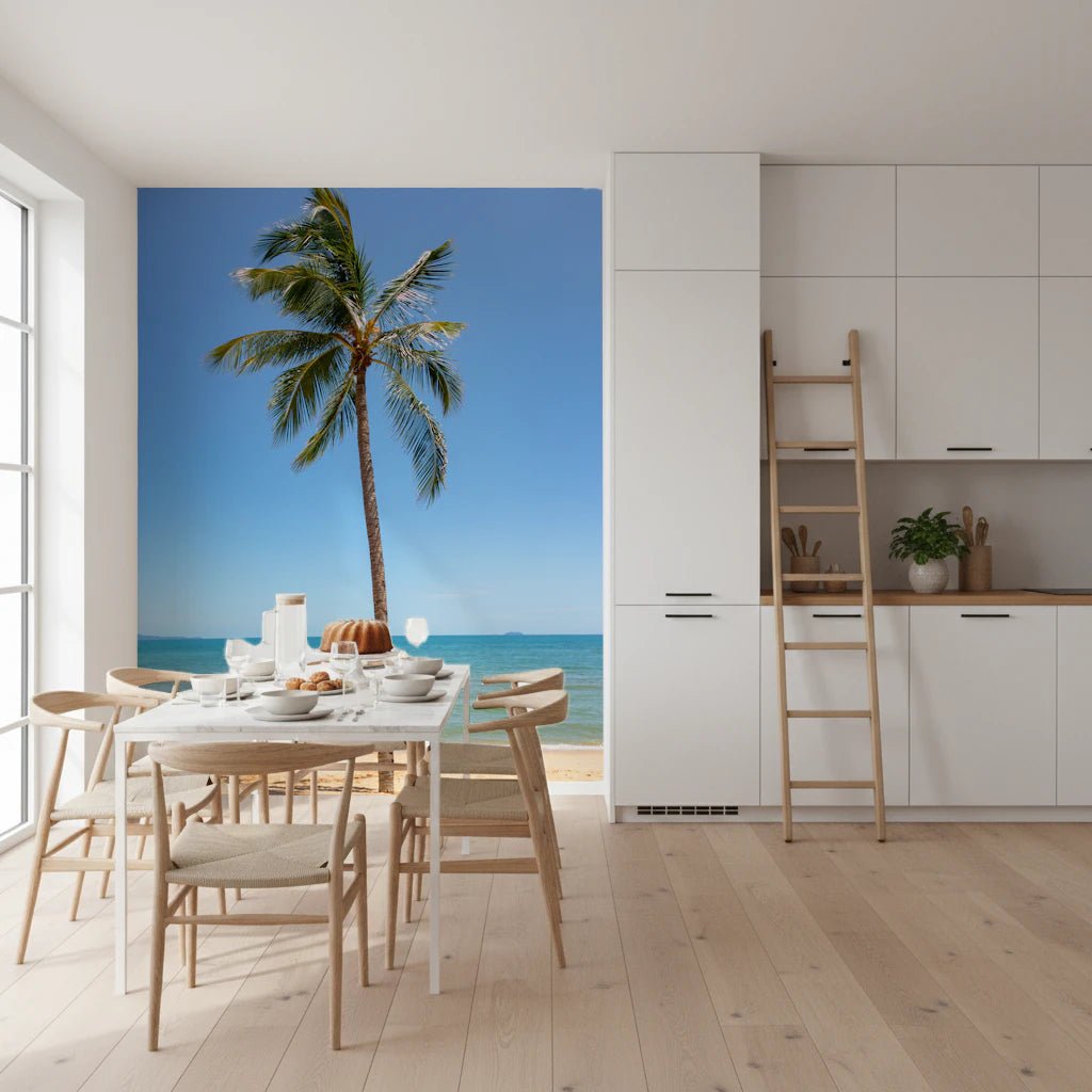 Tropical Retreat wallpaper mural of a palm and blue sea behind a white dining table in a bright kitchen