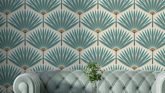 Tropical Teal Paradise wallpaper mural with Art Deco palm fans behind a tufted sage velvet sofa in a living room