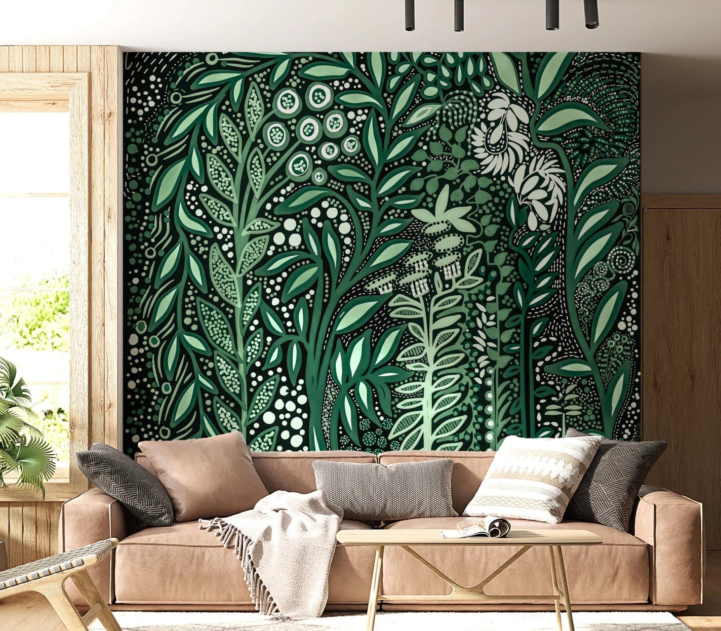 Tropifolia Alborosa green botanical leaf wallpaper mural behind a tan leather sofa and gold coffee table