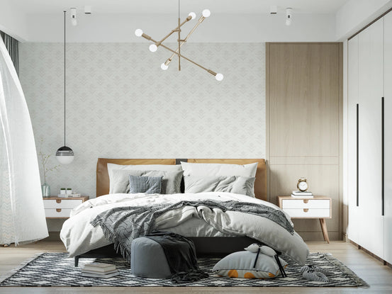 Tulip Cream wallpaper behind a leather headboard bed and gold sputnik chandelier in a bedroom