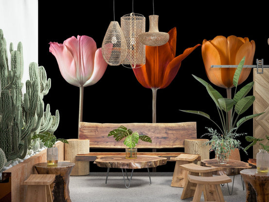 Tulip Trio wallpaper mural with pink, red and orange tulips on black behind a cactus garden and wooden bench lounge