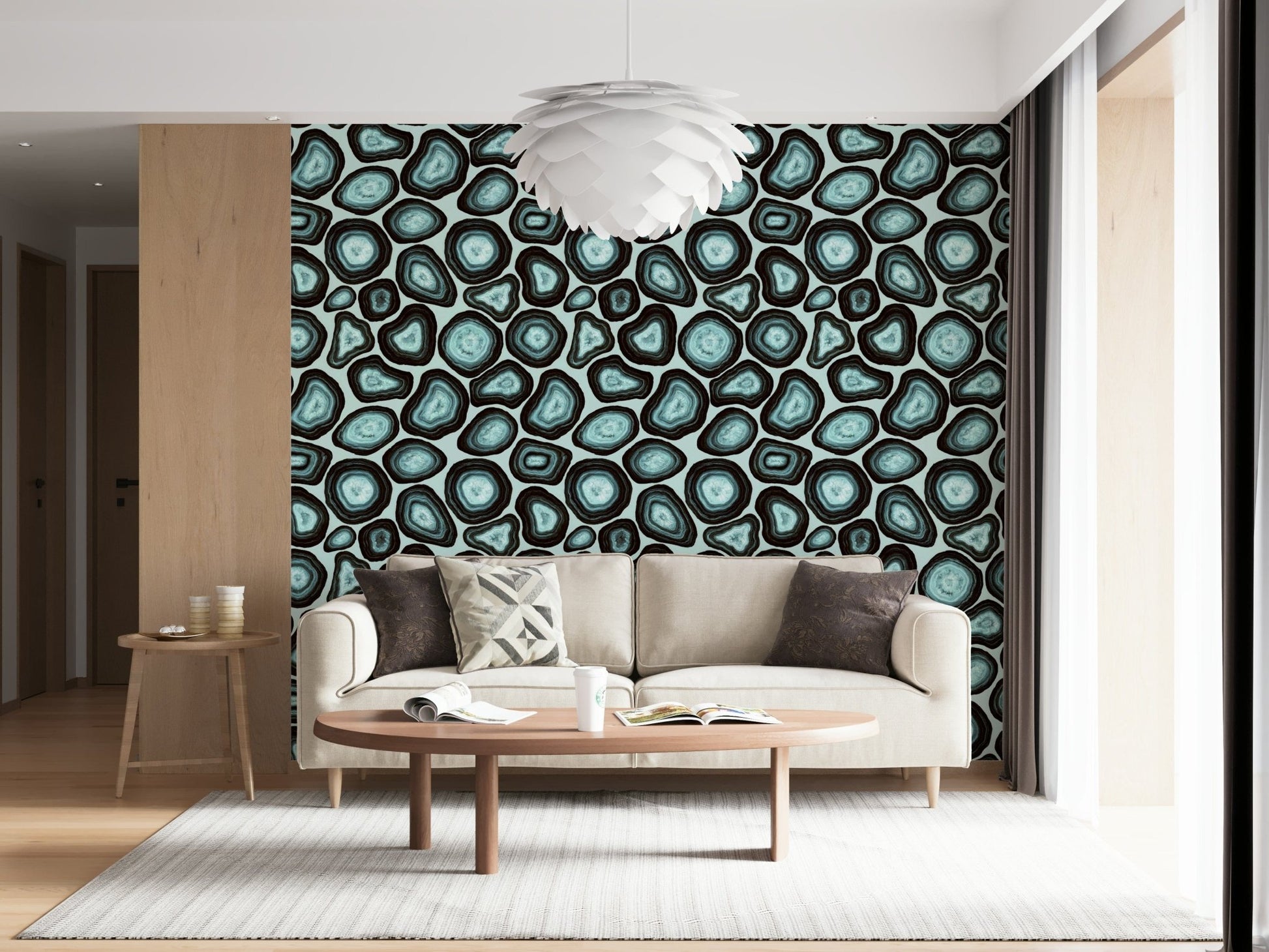 A patterned wallpaper with turquoise geode-style forms outlined in deep, earthy rings.