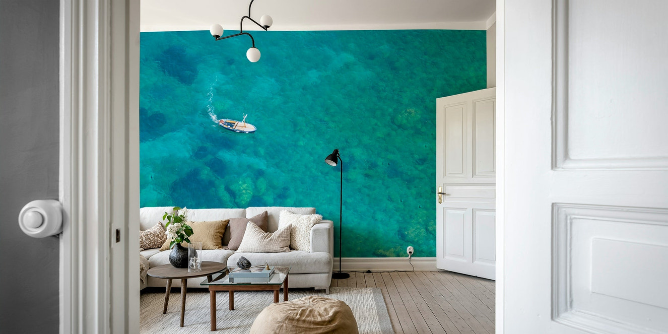Turquoise blue beach mural with calm waves

