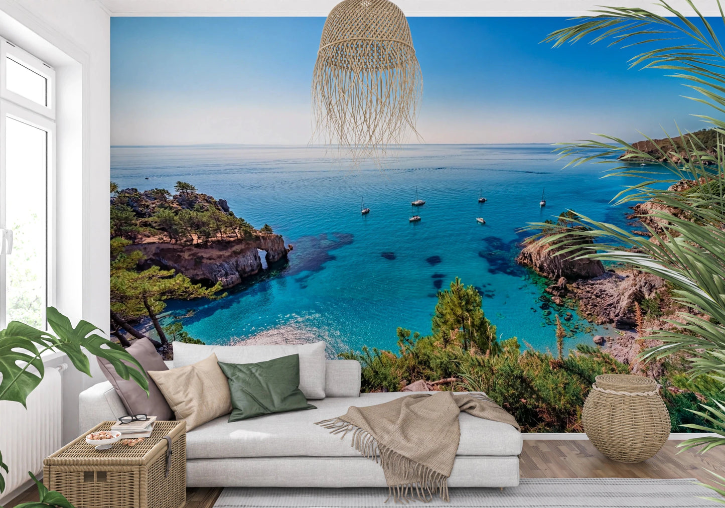 Turquoise Cove Escape wallpaper mural of the cove behind a white sectional sofa with woven pendant