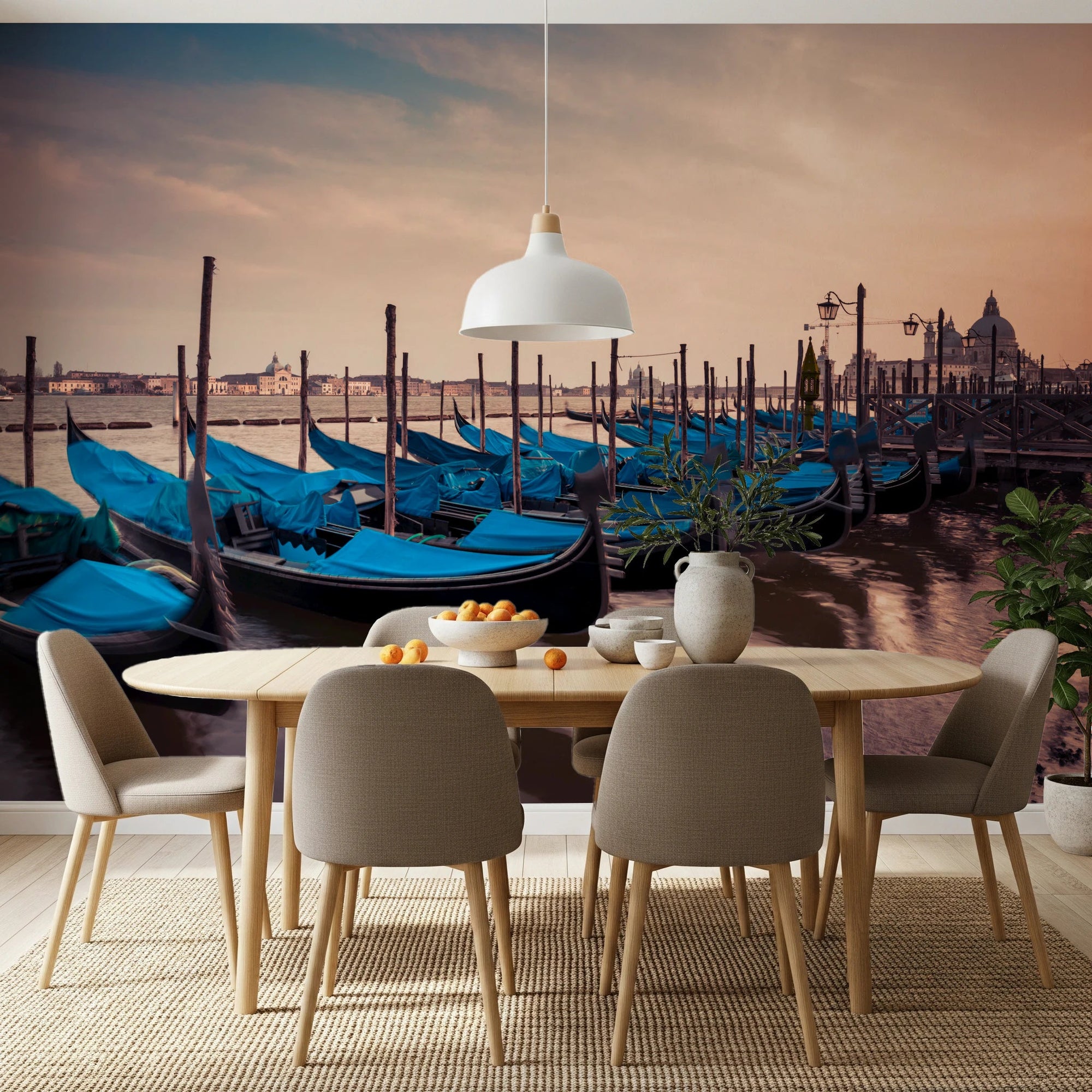 Twilight Gondolas wall mural of blue Venice gondolas at sunset above a wood dining table