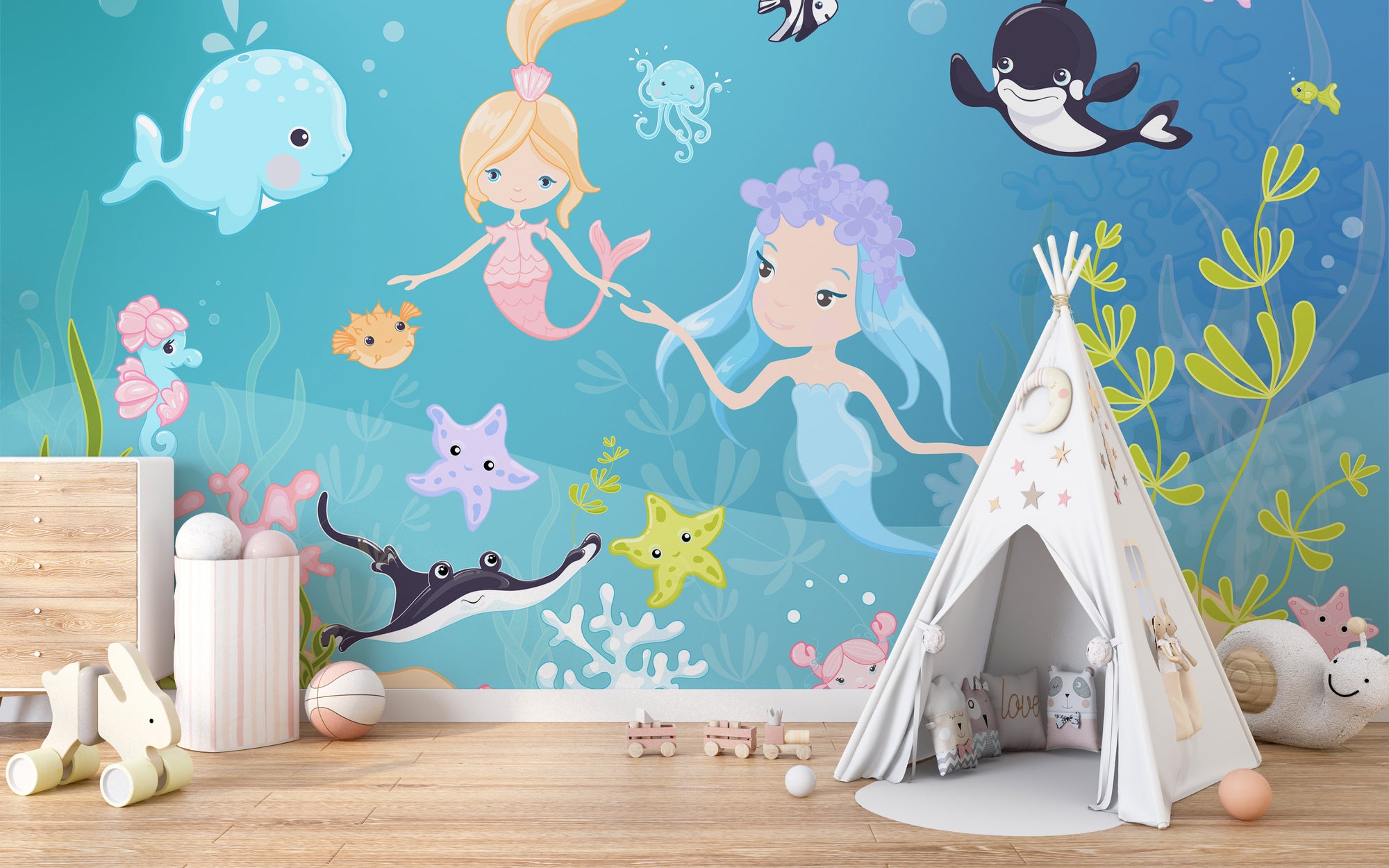 Underwater Adventure mural with two mermaids, whale and orca above a teepee tent in a kids playroom