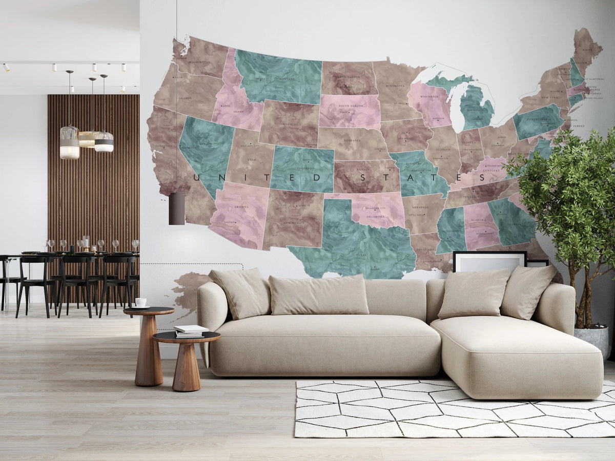USA map with states and capitals in muted watercolor wallpaper mural behind a beige sectional sofa in a living room
