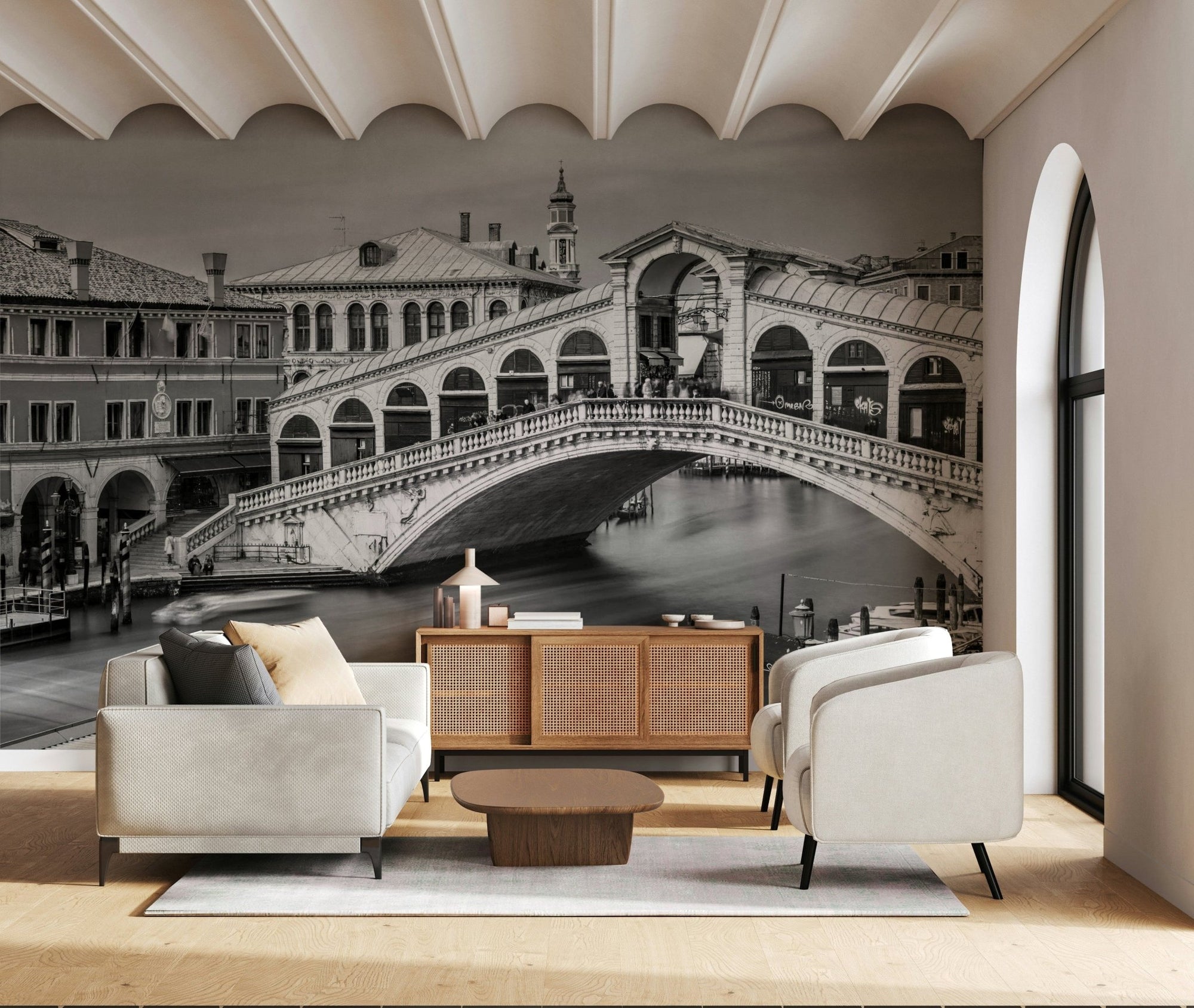 Venetian Bridge Serenity wallpaper mural of the black and white Rialto Bridge behind a white sofa and cane sideboard