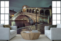 Iconic Rialto Bridge wall art, majestic Italian canal crossing, nighttime photograph.