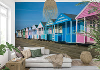 Seafront huts wall mural with blue sky