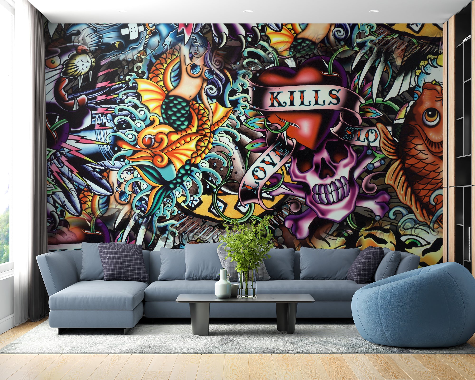 Vibrant Tattoo Style Graffiti wallpaper mural with a skull and koi behind a blue-grey sectional sofa