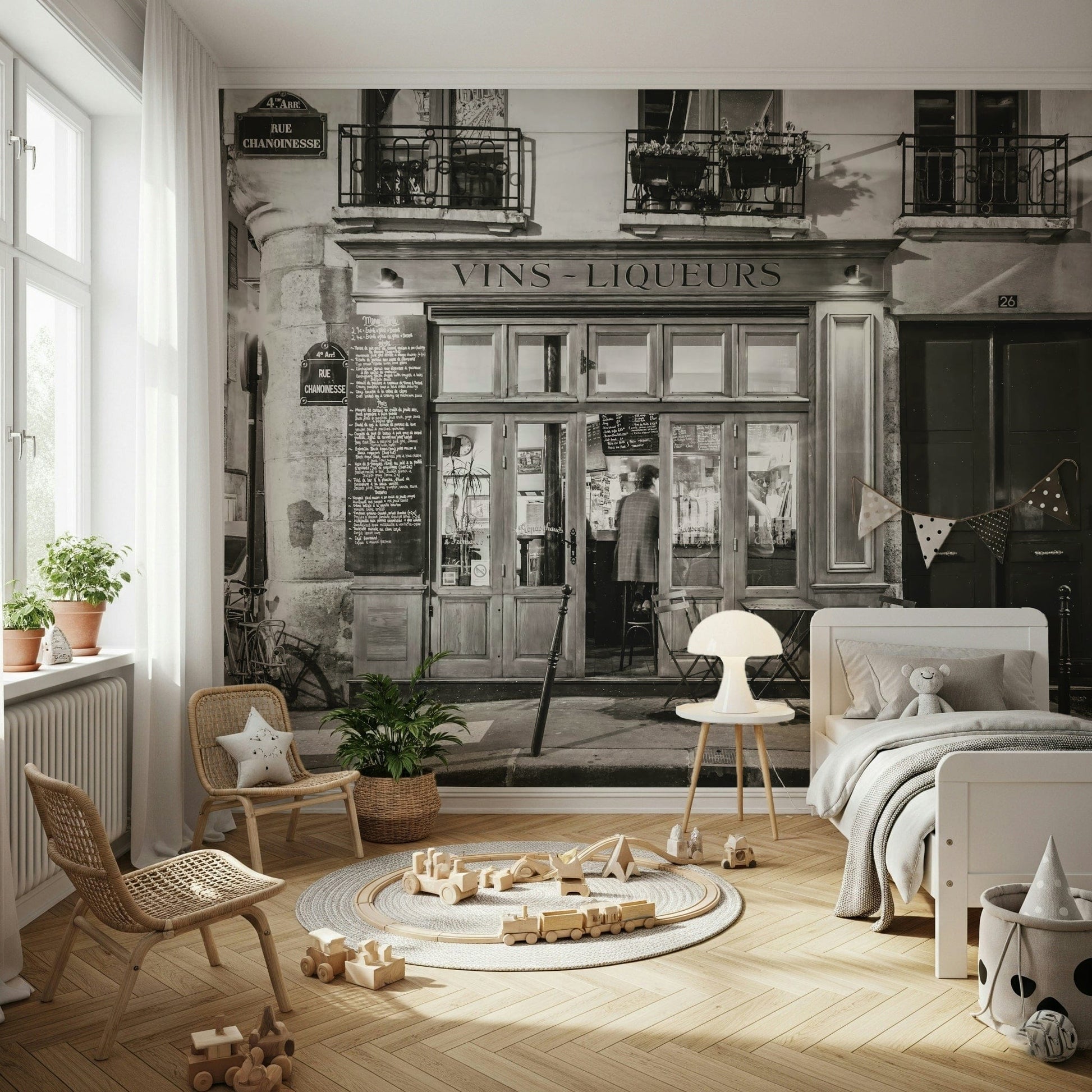 Authentic bistro windows and balconies above the shop mural.