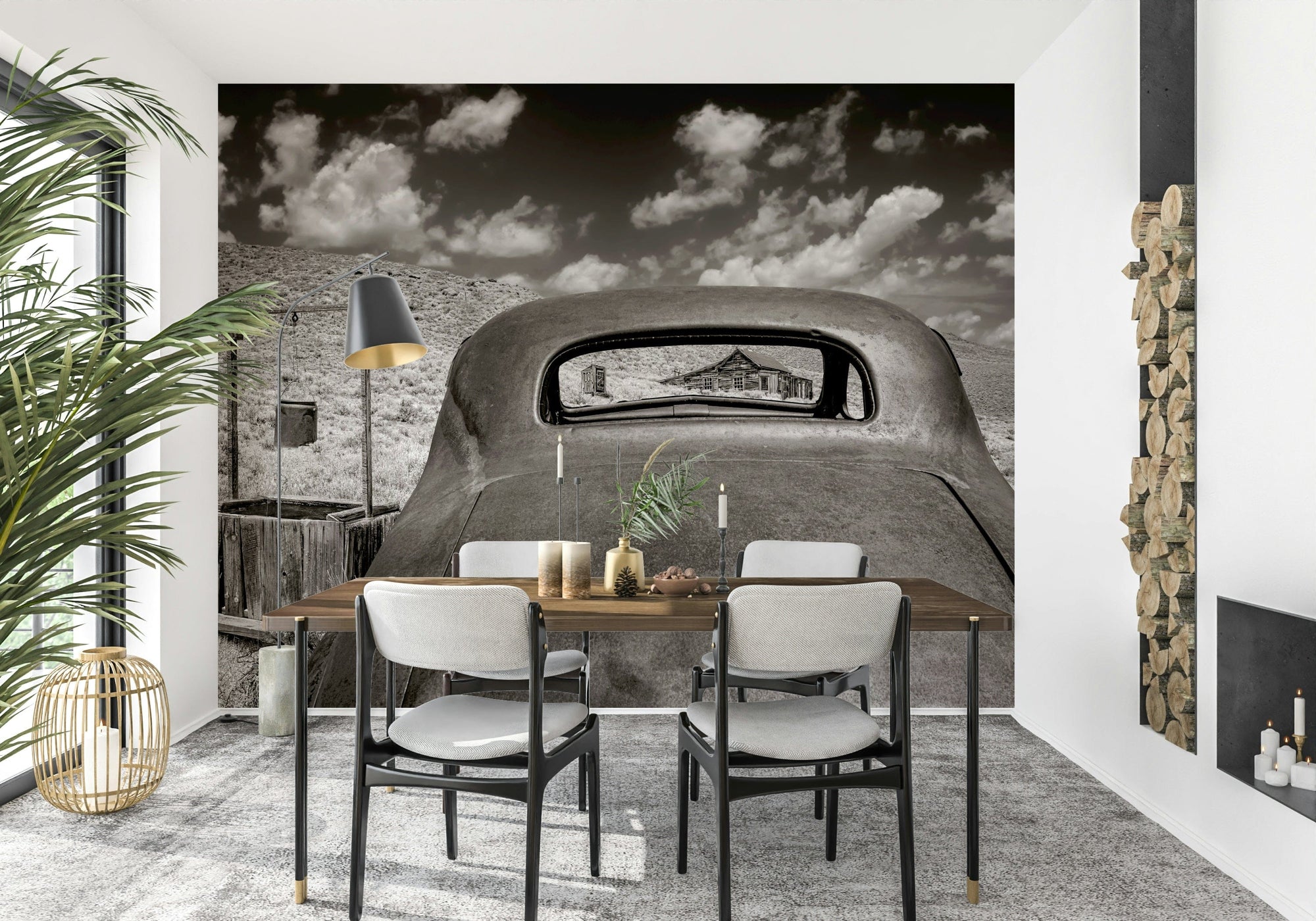 Ghost Town Relic wallpaper mural of a rusted vintage car in the desert behind a wood dining table and chairs