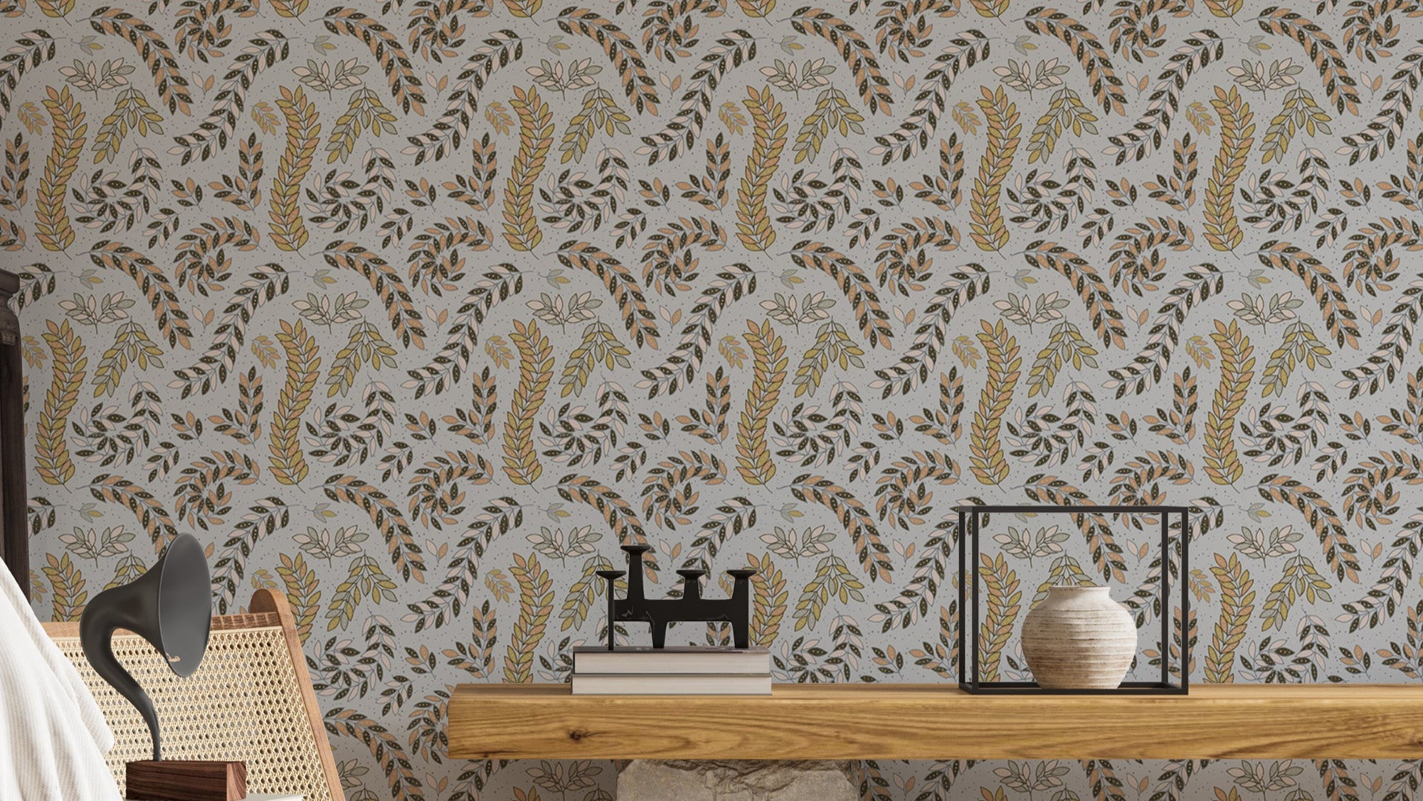 Vintage Foliage Golden and Gray wallpaper behind a wooden console with caned chair and books