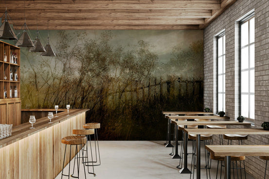Overgrown Haze wallpaper mural of a misty meadow with dried wildflowers in a bar with wood counter and brick wall
