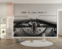 Vintage Typewriter Quote wallpaper mural in black and white in a kids room with lit niche shelves and bunny toys