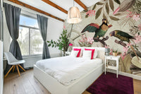 Jungle-inspired wall mural with lush tropical plants and flowers

