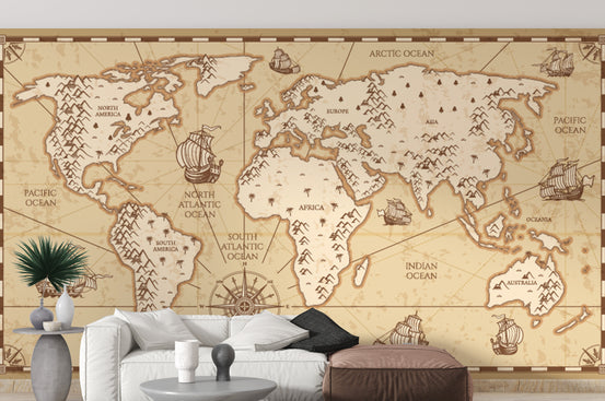 Vintage World Map wallpaper in sepia with sailing ships above a white sofa in a bright living room
