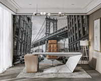 Several parked cars are visible along the cobblestone street.

