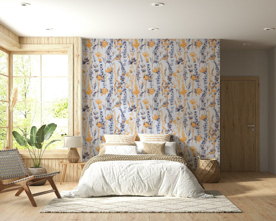 Warm Meadow Harmony wallpaper of orange and blue wildflowers behind a bed with woven pillows in a wood bedroom