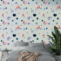 Soft watercolor wallpaper featuring subtle, space-inspired speckles.

