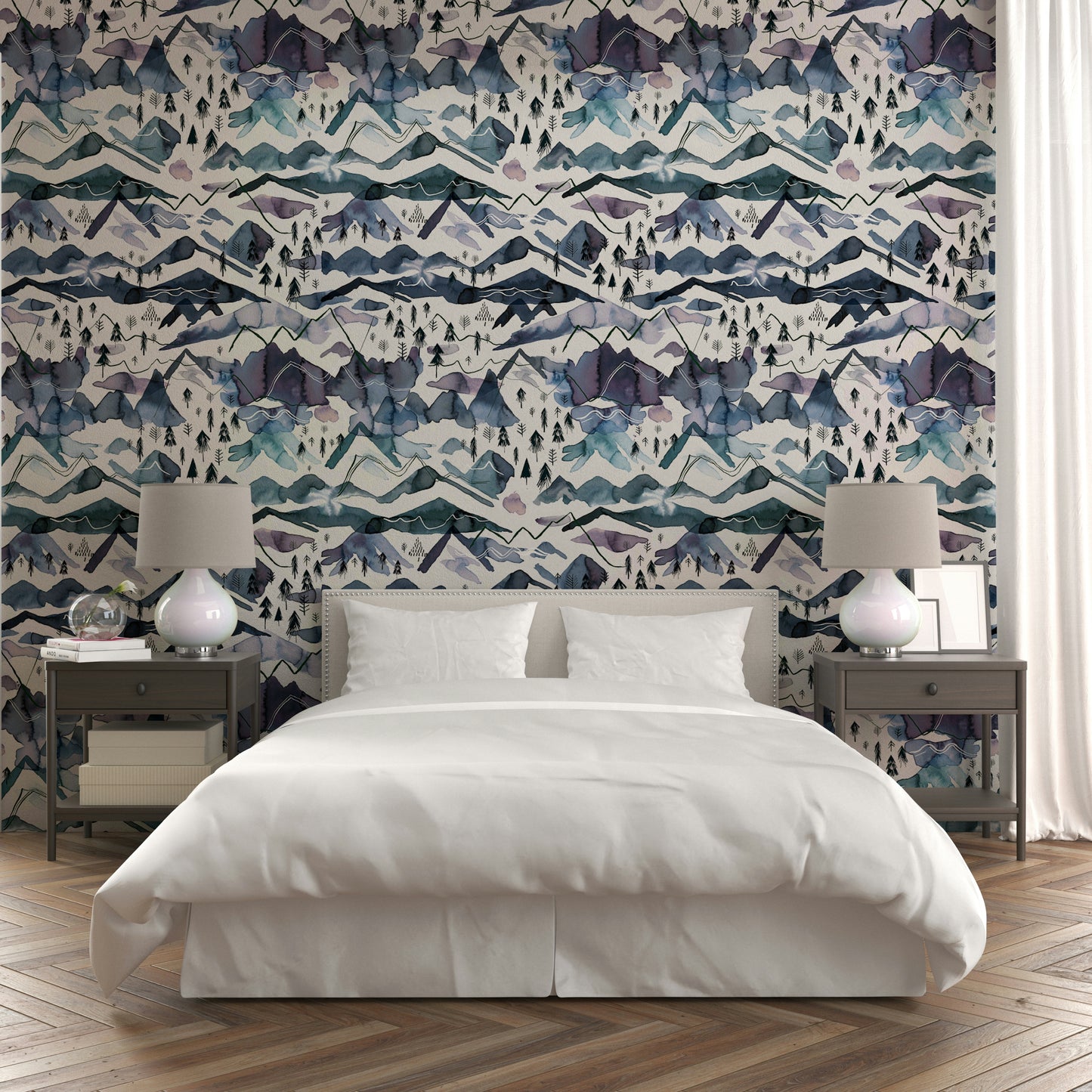 Wallpaper with misty mountain ranges in soft watercolor layers.

