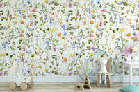 Wall mural with a watercolor wildflower meadow.

